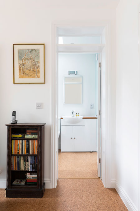 0527 bathroom with cork floor and white units near Hampstead Heath